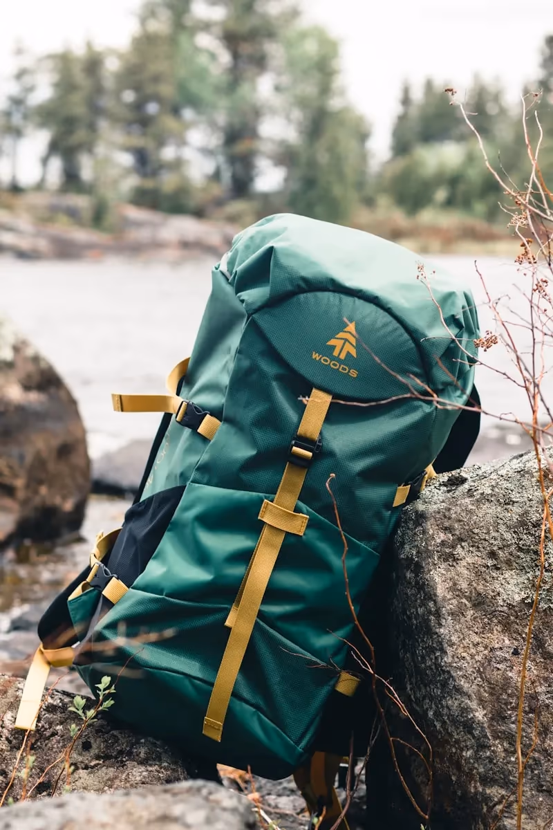A fully packed bug out bag with survival gear laid out