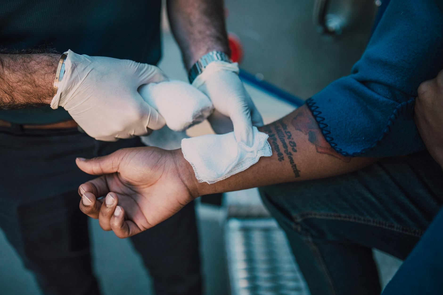 First aid being administered in the field showing incorrect technique being corrected
