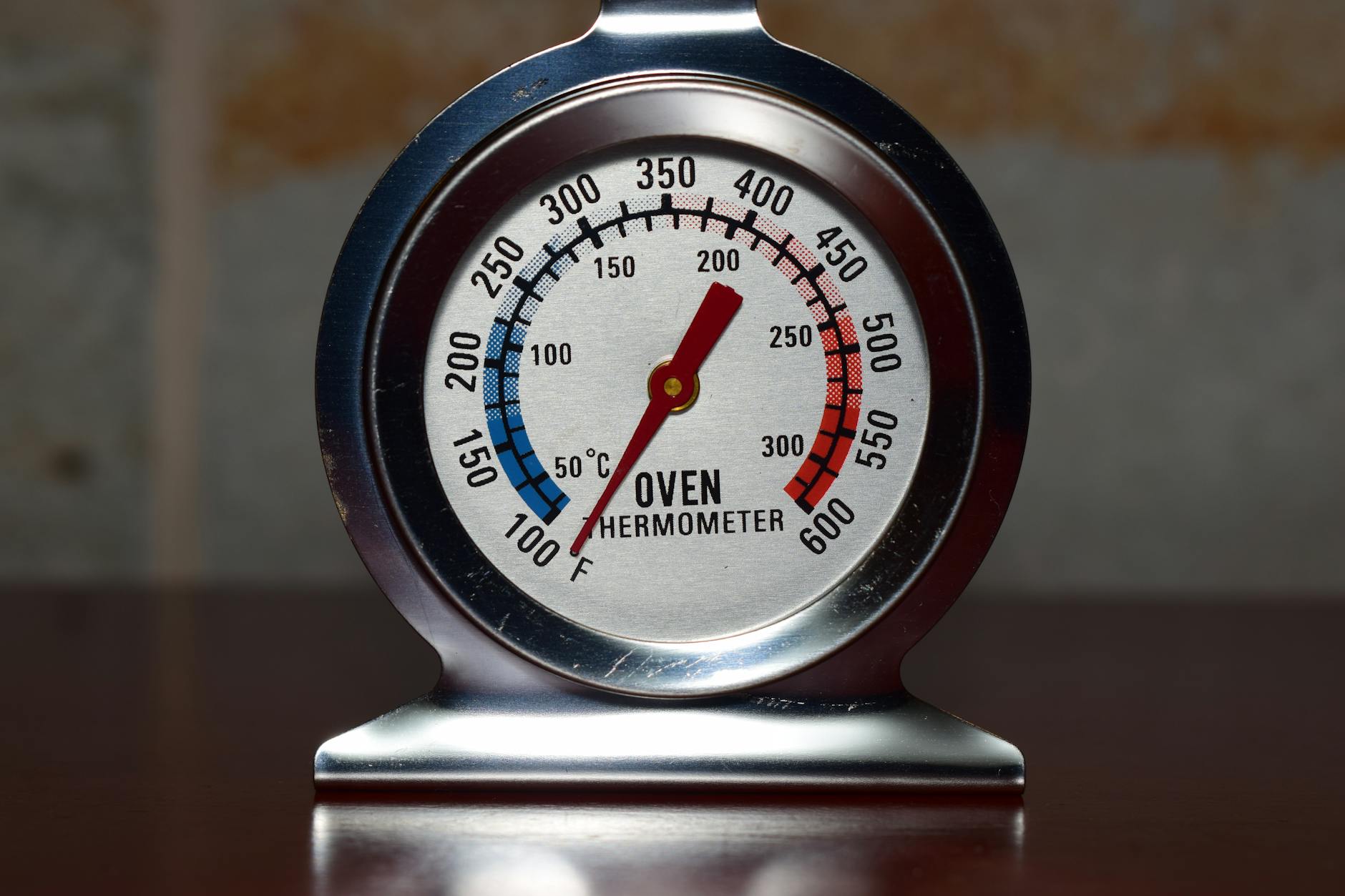 Open refrigerator with a thermometer showing rising temperature during power outage