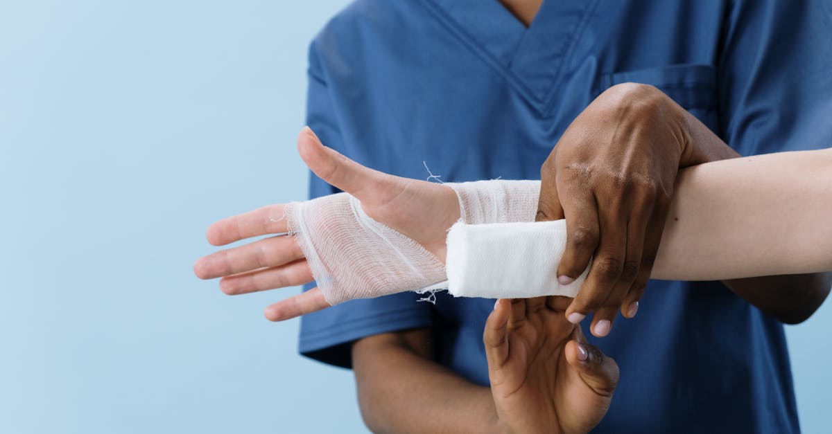 Improvised field splint made from branches and bandages on a forearm